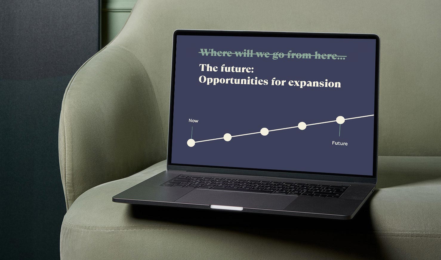 laptop on sofa showing a presentation slide with a headline that reads "The future: Opportunities for expansion